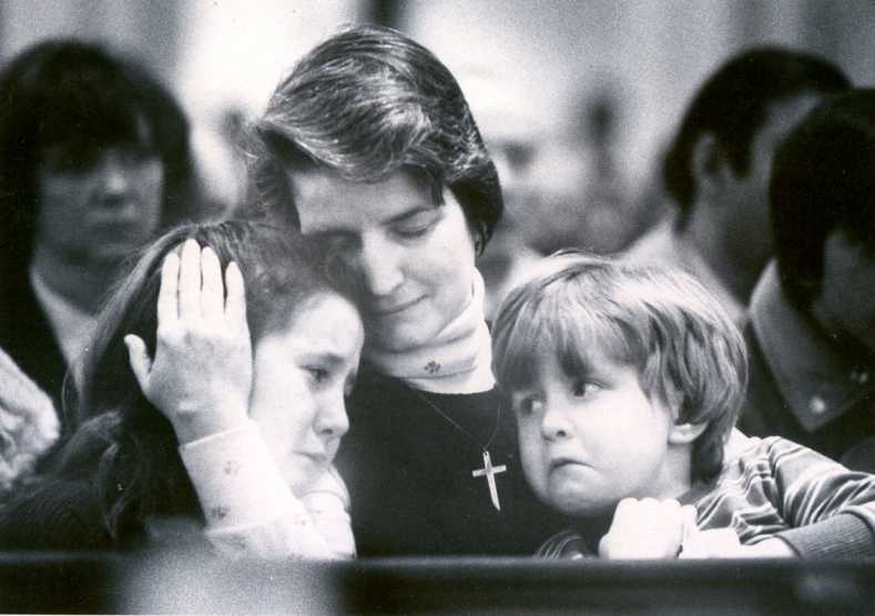 Maura Melody and her children attend the funeral for husband and father, Danbury Fire Lt. Martin ''Butch'' Melody. Melody and his best friend, firefighter Joseph Halas, died battling a factory fire. 1982.