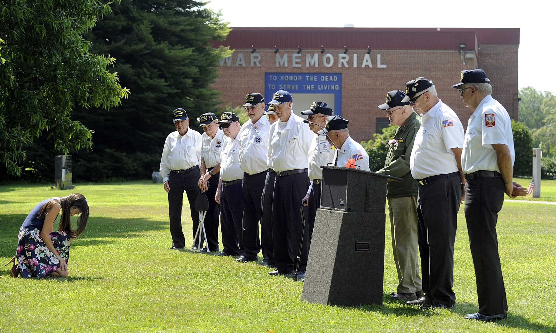 Korean-American Hannah Y Kim bows in respect to the veterans of the Korean War.