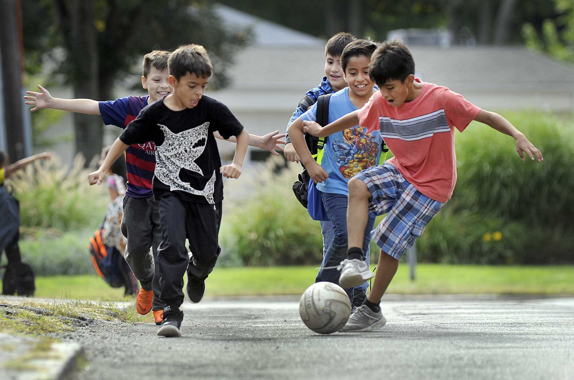 These kids say they play soccer ''all the time,'' every chance they get - including this day, on the way home from school. 