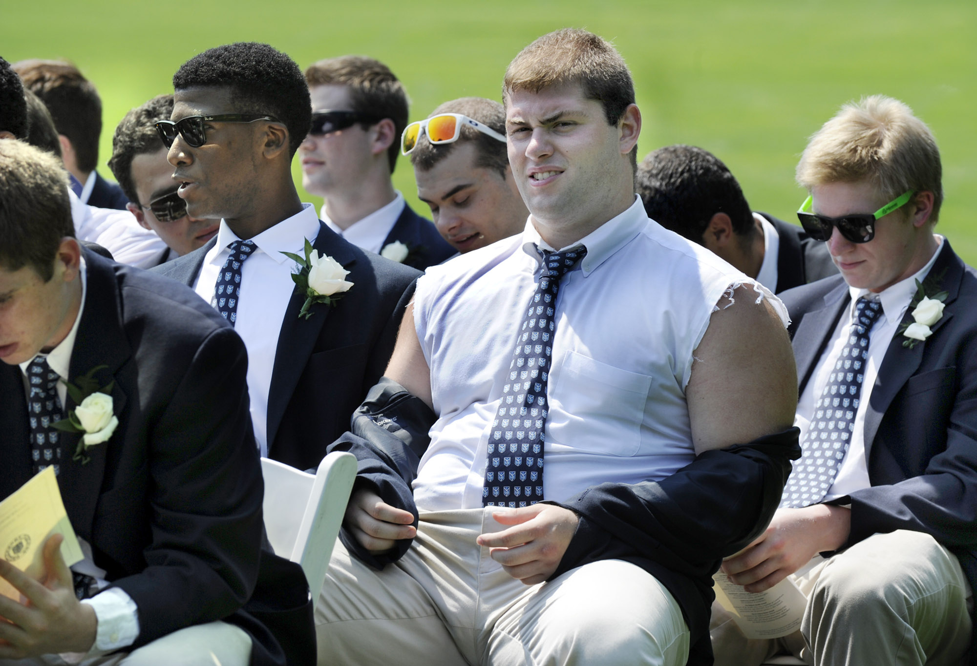 This student had a plan to beat the heat at his prep school graduation ceremony, wearing a dress shirt with cut off sleeves. 